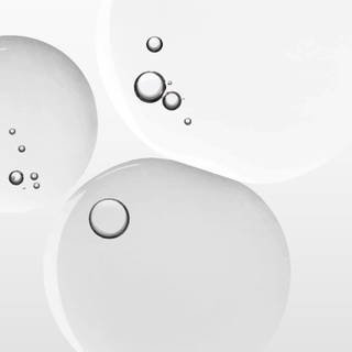 Close-up of water droplets on a white background